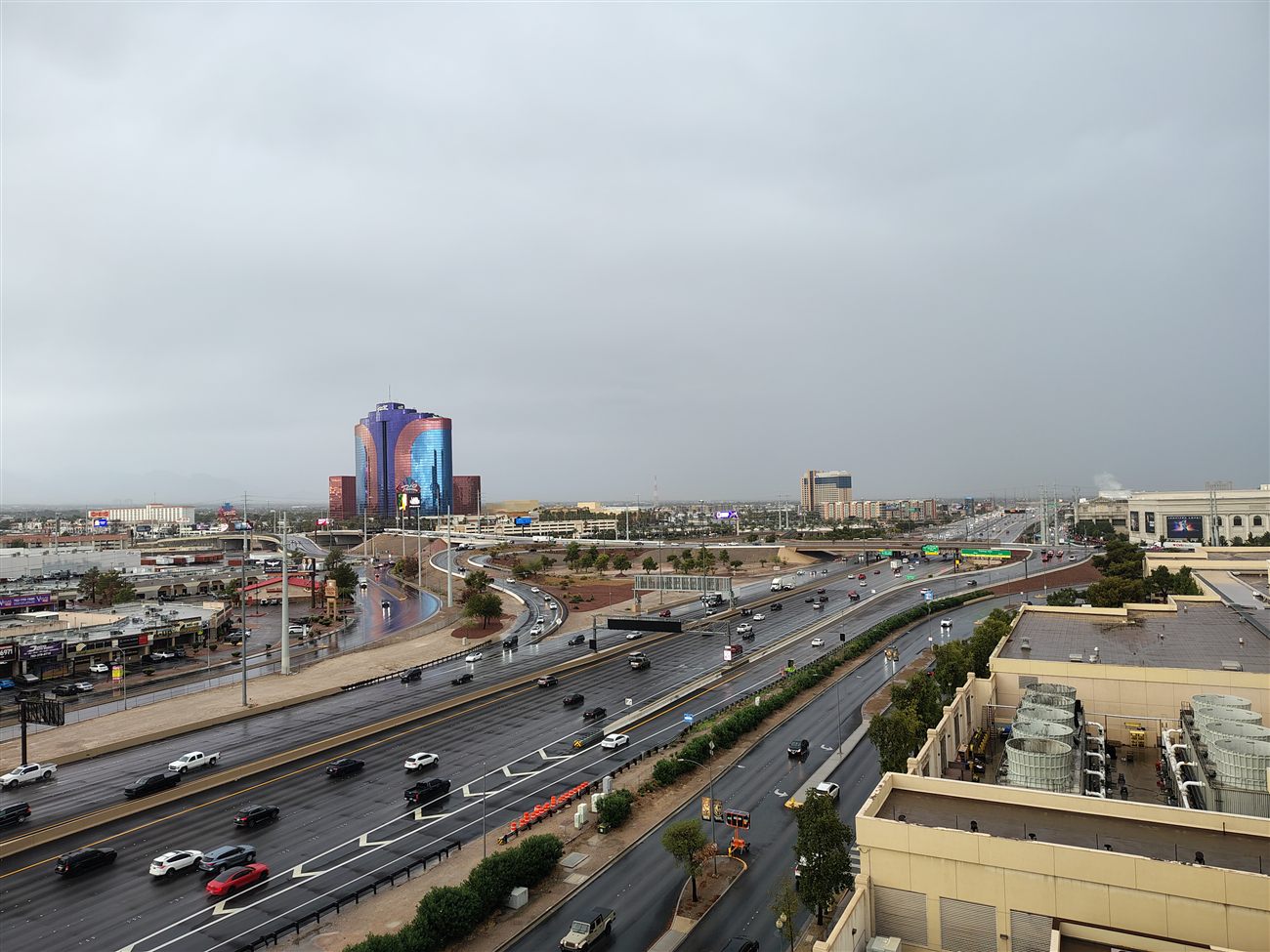 The Rio hotel towers seen from a rainy overpass