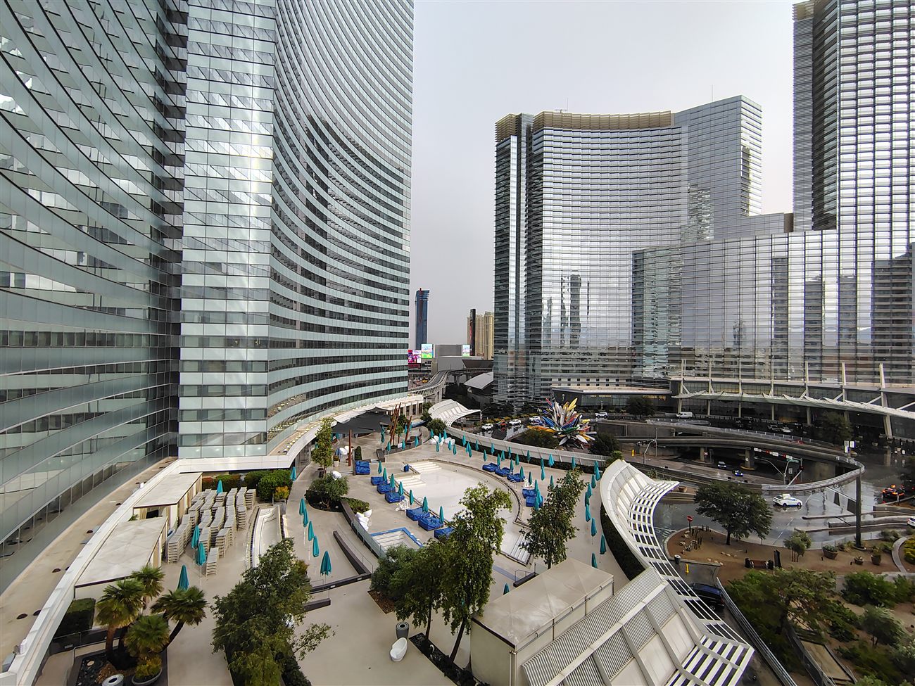 Curved glass towers of CityCenter against a cloudy sky