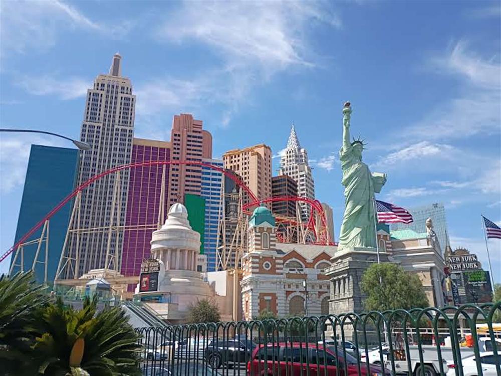 The Statue of Liberty replica against a clear blue sky