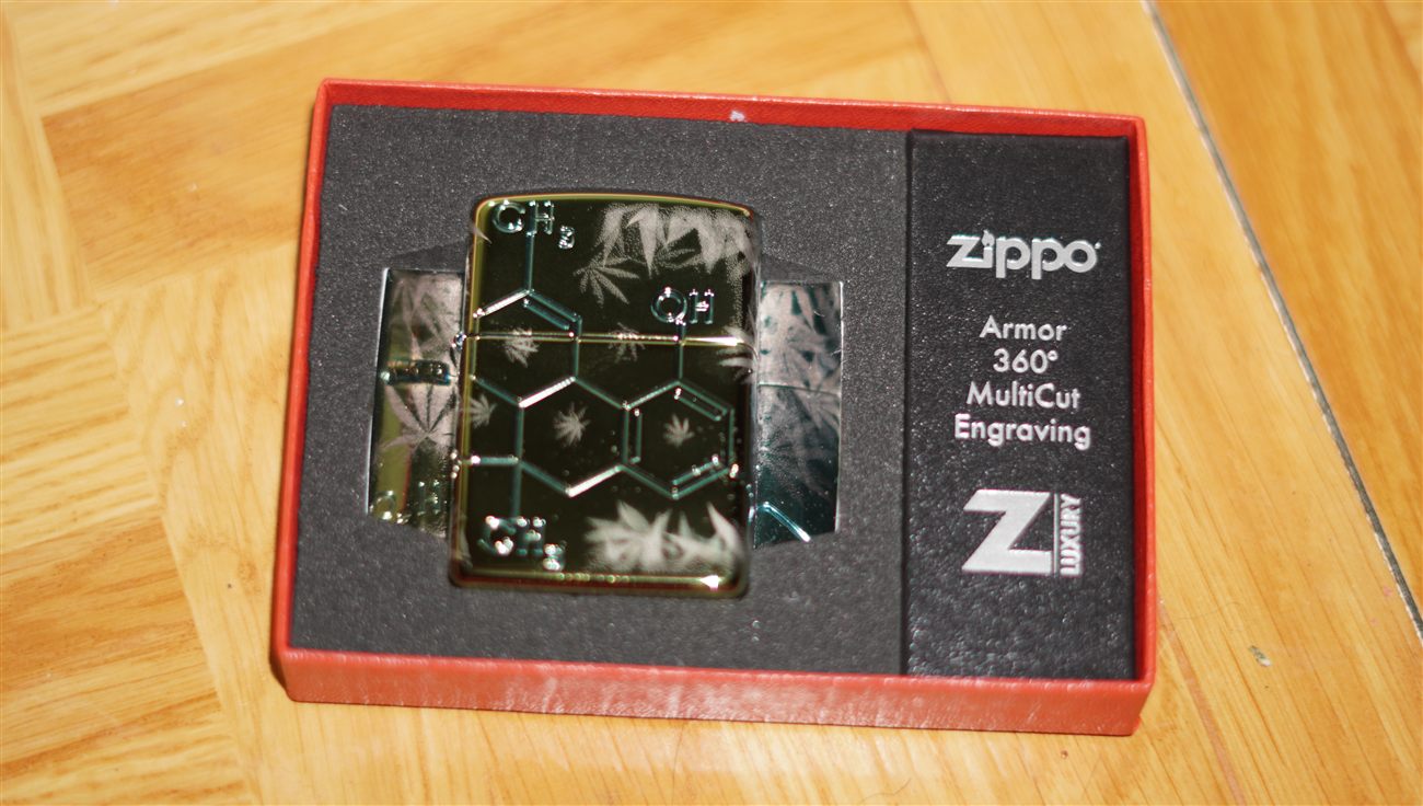 A Zippo lighter engraved with a cannabis molecule diagram