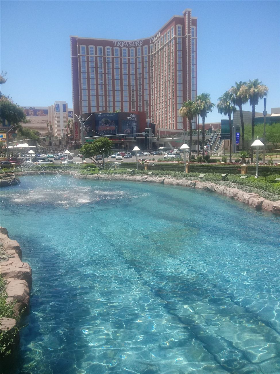 Treasure Island's fountain with the Las Vegas skyline behind it
