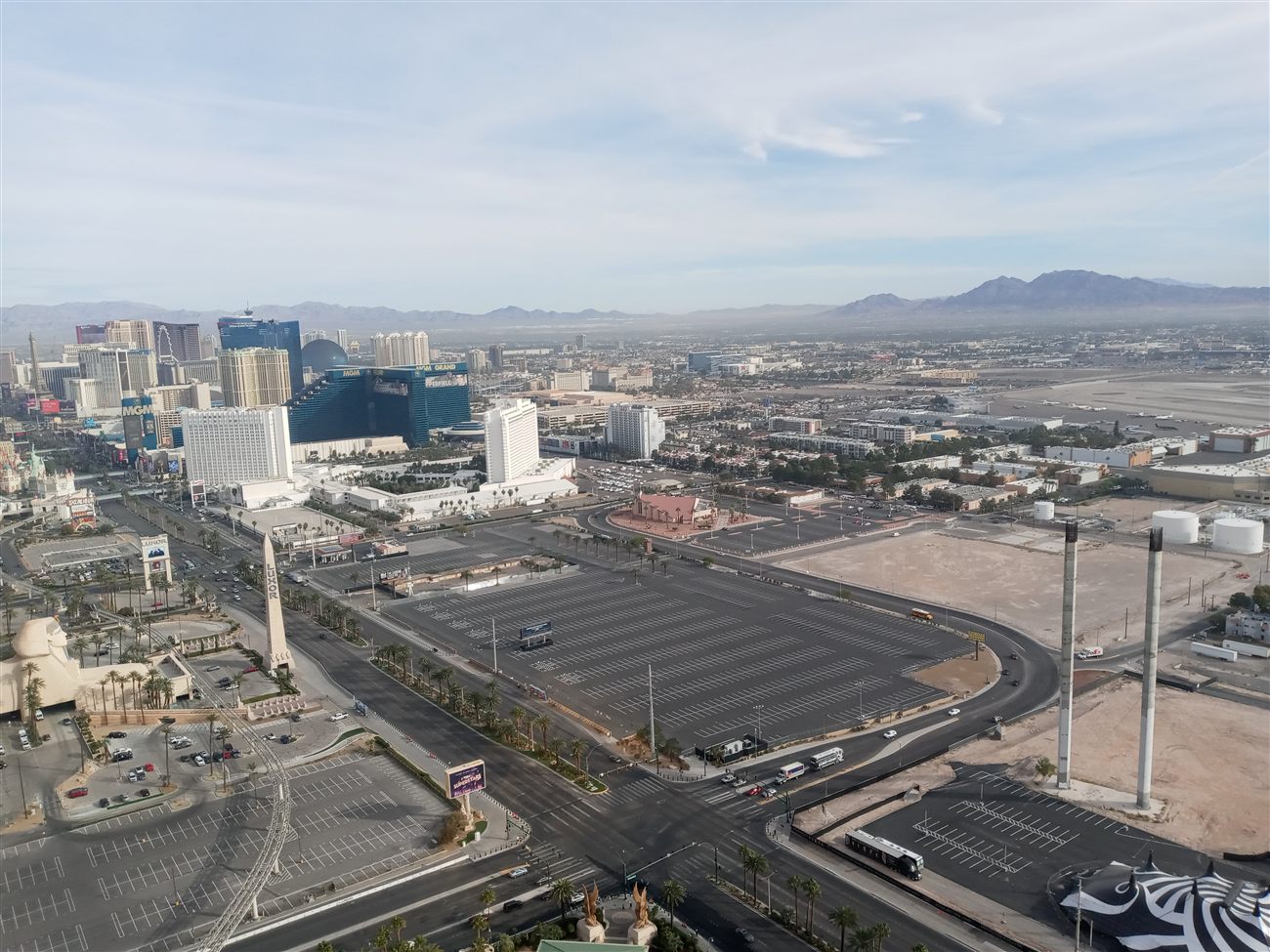 Aerial view of the Luxor obelisk, Sphinx, Excalibur, and MGM Grand at sunrise