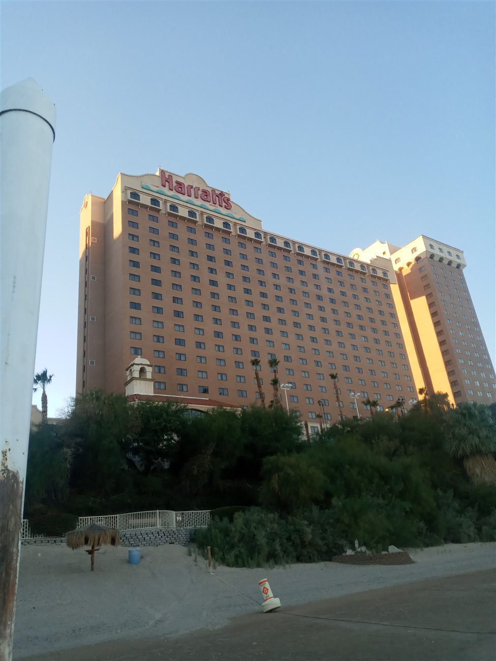 Harrah's Laughlin hotel tower lit by golden hour sun
