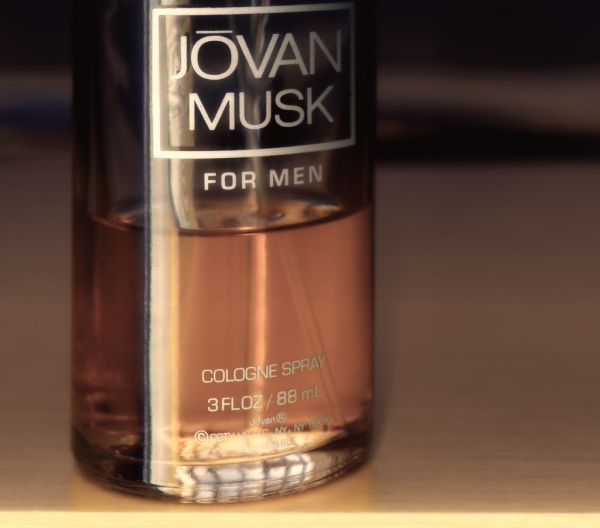 A close-up of a Jovan Musk for Men cologne spray bottle