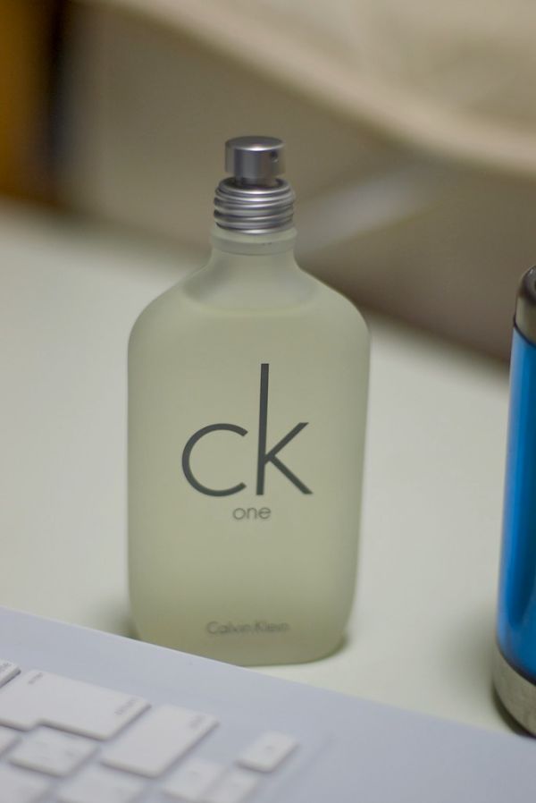A frosted bottle of Calvin Klein CK One on a desk